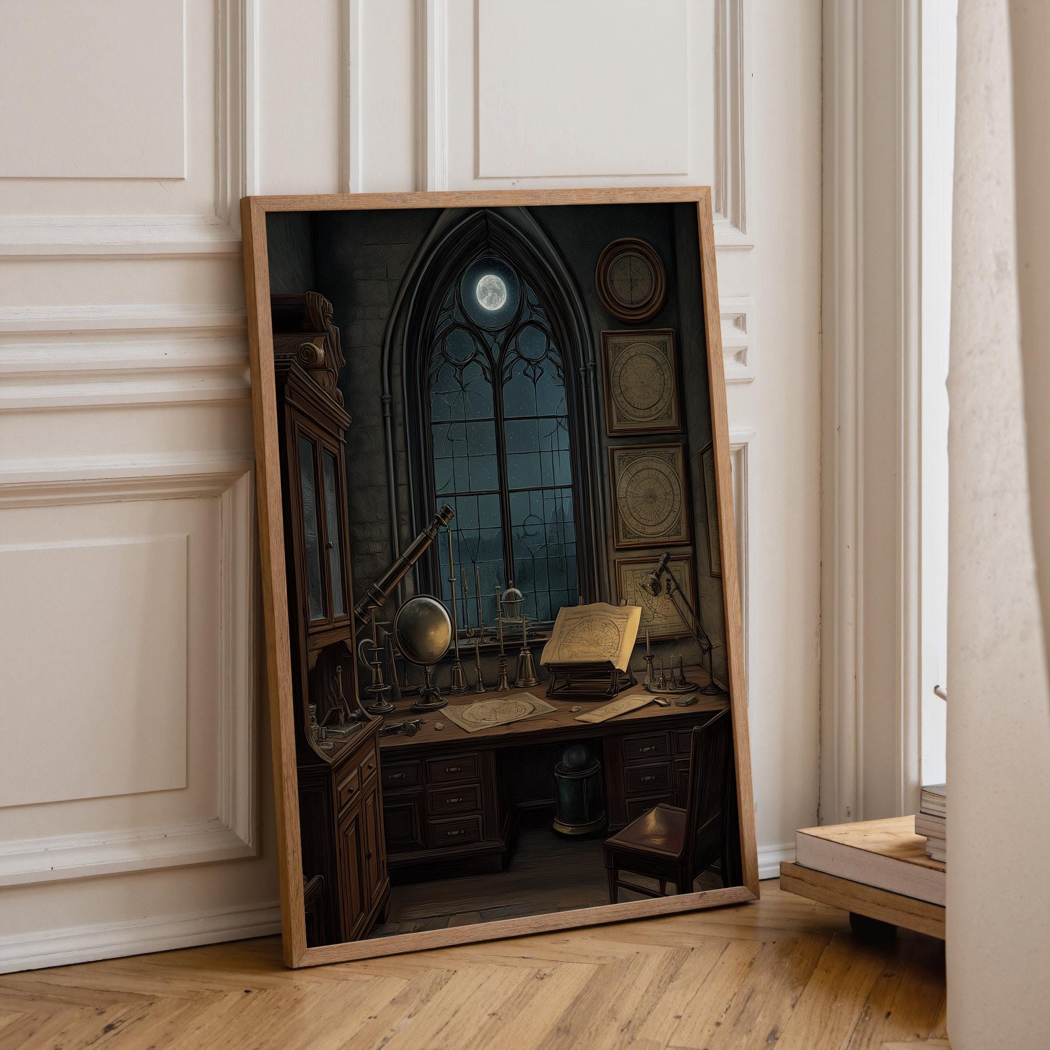 A framed art print depicting a dark, moody study with a large arched window, moonlit sky, desk, books, and a chair, leaning against a cream paneled wall on a wooden floor.