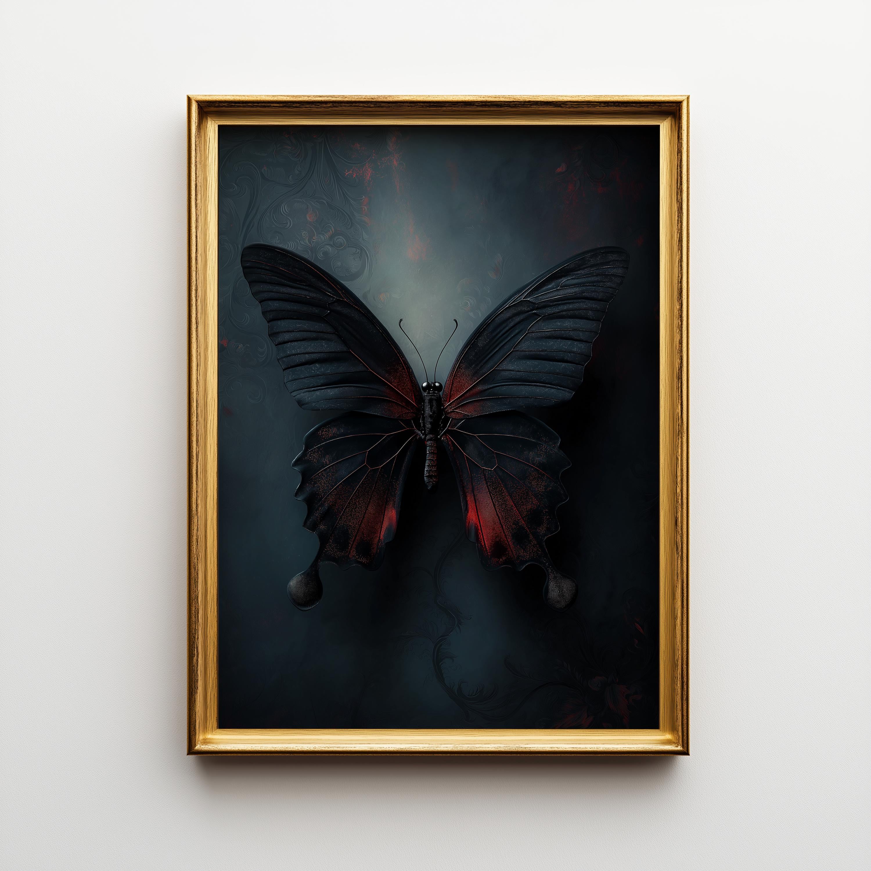 A framed art print featuring a dark butterfly with red accents on a moody black and blue background, enclosed in a gold frame and mounted on a light gray wall.